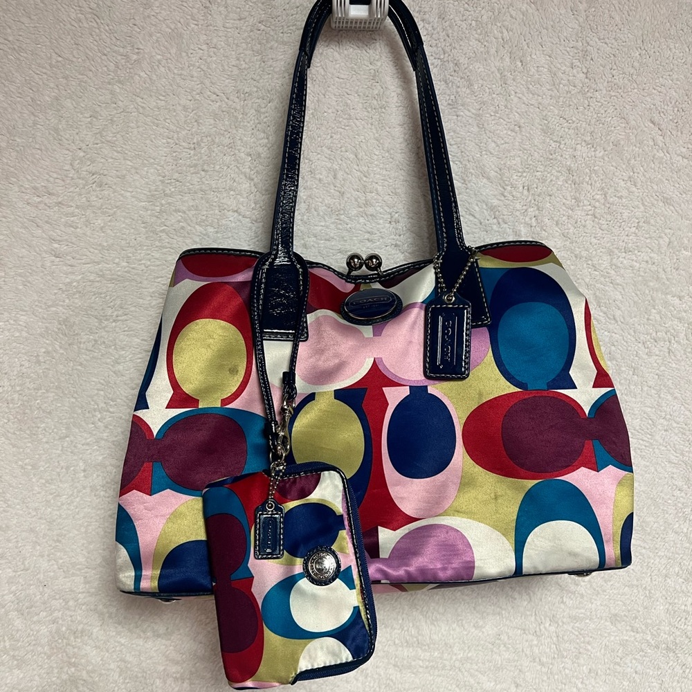 Coach kiss lock purse with wristlet wallet.